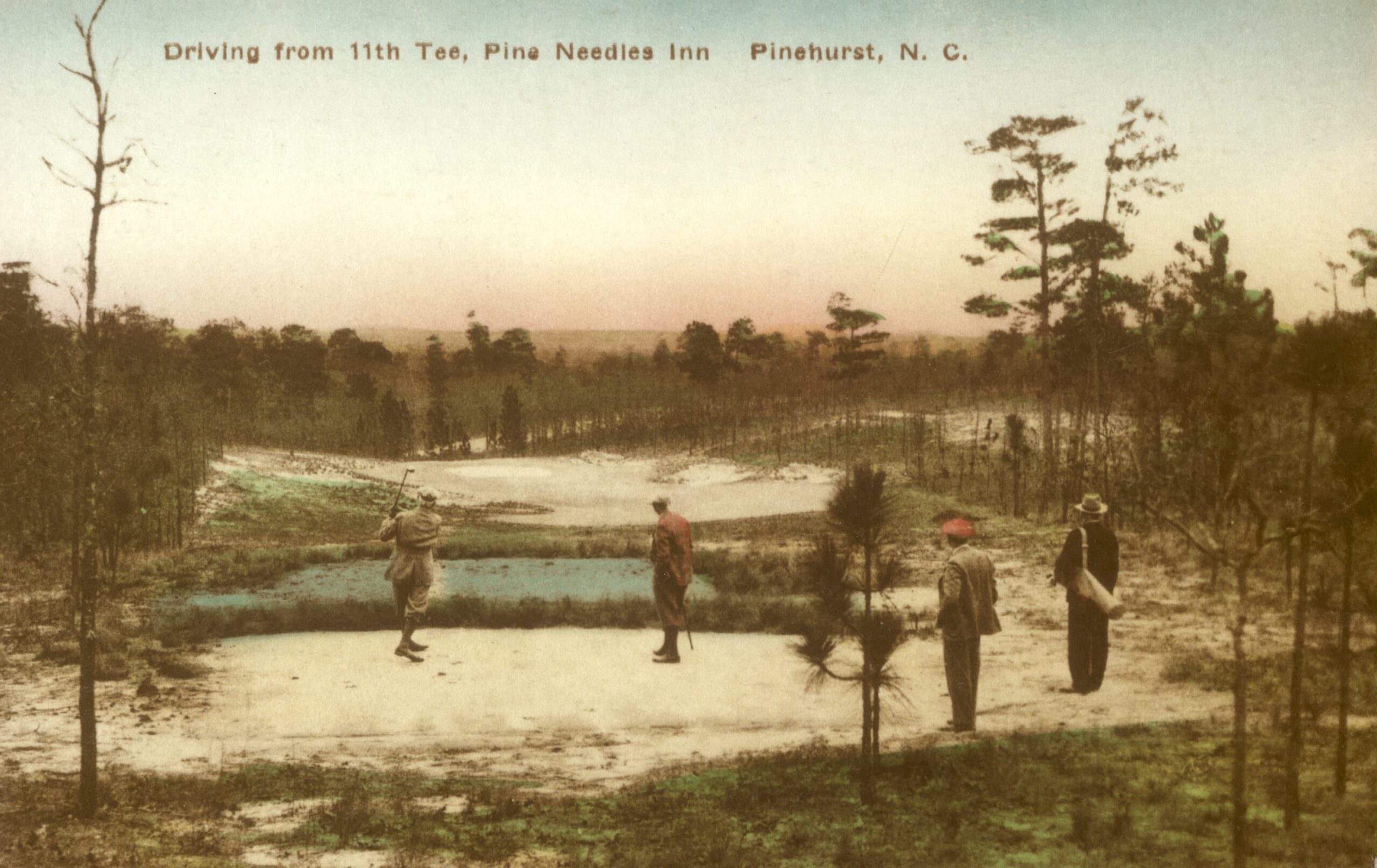 A historic postcard depicting a golfer taking a shot from the 11th tee at Pine Needles Inn in Pinehurst, NC. Three individuals observe the golfer, surrounded by sparse pine trees and a serene landscape at dusk.